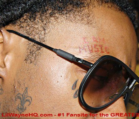 This i s Lil Wayne's exclusive tats that reads I AM MUSIC 